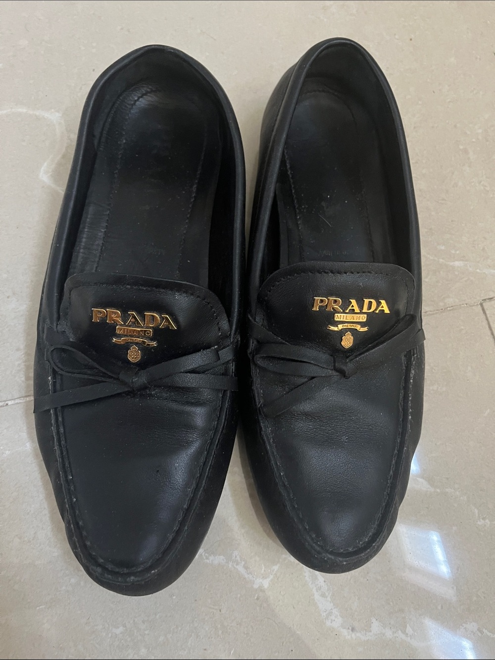 Prada Black Leather Slip-On Loafers with Gold Logo